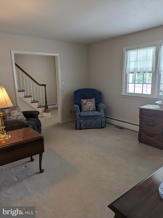 3339 Bruun Ave, Vineland, NJ 08360 - living room featuring a baseboard radiator, carpet flooring, and stairs