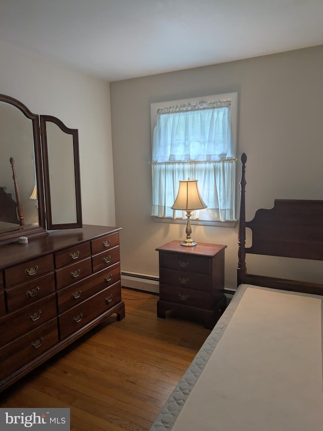 3339 Bruun Ave, Vineland, NJ 08360 - bedroom with a baseboard radiator and dark wood-type flooring