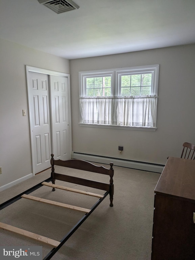 3339 Bruun Ave, Vineland, NJ 08360 - bedroom featuring baseboard heating, carpet, and a closet