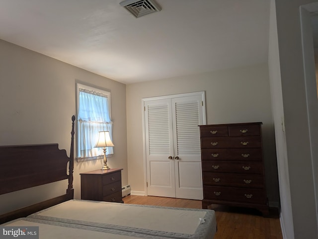 3339 Bruun Ave, Vineland, NJ 08360 - bedroom with a baseboard radiator, wood finished floors, and a closet