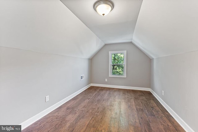 3819 Hayward Ave, Baltimore, MD 21215 - bonus room with dark wood-style floors, lofted ceiling, and baseboards