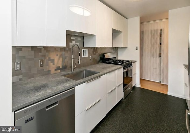 3600 Conshohocken Ave Unit 705, Philadelphia, PA 19131 - kitchen featuring appliances with stainless steel finishes, white cabinetry, modern cabinets, and backsplash