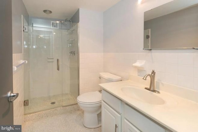 3600 Conshohocken Ave Unit 705, Philadelphia, PA 19131 - full bath featuring a shower stall, tile patterned floors, vanity, tile walls, and a wainscoted wall