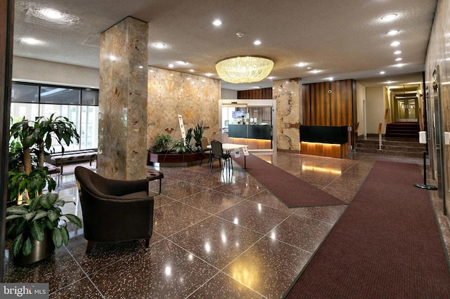 3600 Conshohocken Ave Unit 705, Philadelphia, PA 19131 - building lobby featuring recessed lighting, a textured ceiling, and stairs