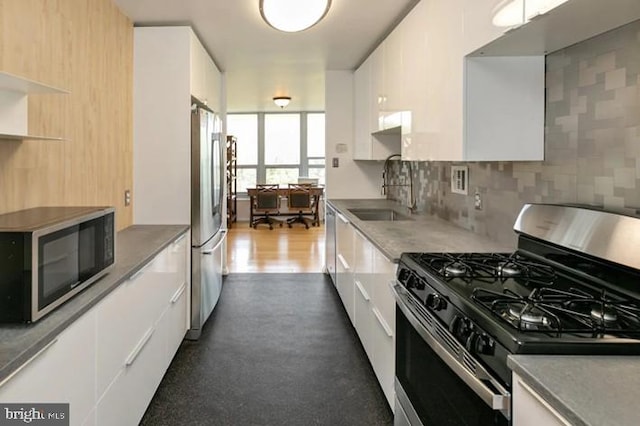 3600 Conshohocken Ave Unit 705, Philadelphia, PA 19131 - kitchen featuring stainless steel appliances, modern cabinets, and white cabinetry