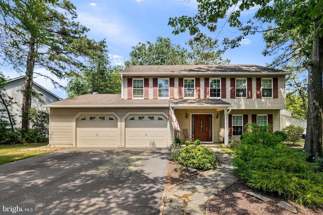 23 Masters Cir, Marlton, NJ 08053 - view of front of home featuring asphalt driveway and an attached garage