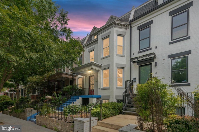 1360 Perry Pl NW, Washington, DC 20010 - view of front of home featuring brick siding and mansard roof