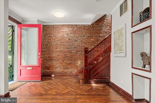 1360 Perry Pl NW, Washington, DC 20010 - entrance foyer with brick wall, healthy amount of natural light, stairs, baseboards, and crown molding