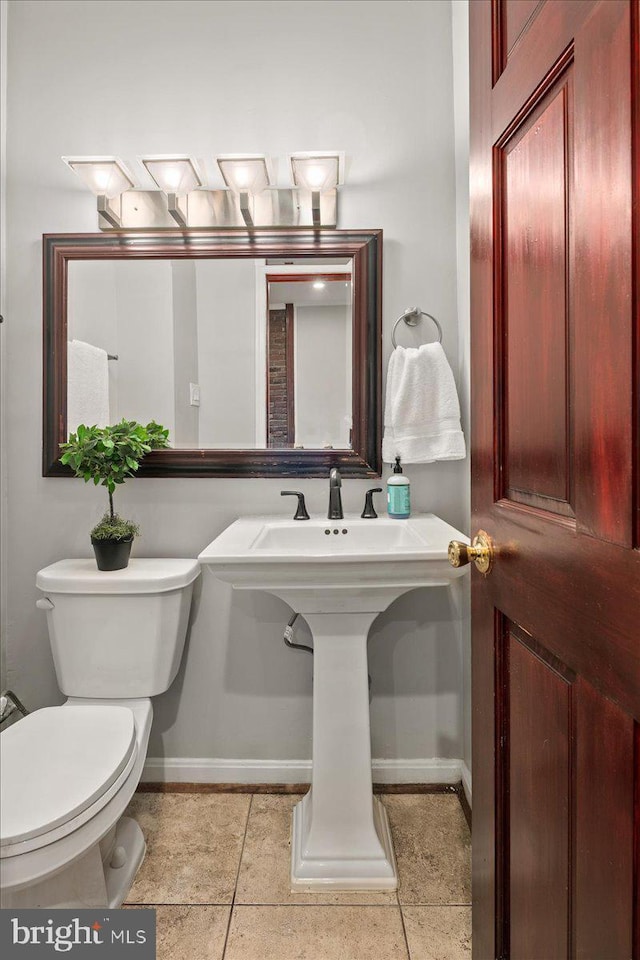 1360 Perry Pl NW, Washington, DC 20010 - bathroom featuring baseboards, toilet, and tile patterned flooring
