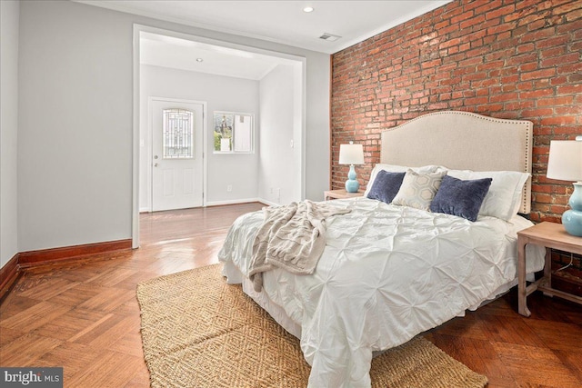 1360 Perry Pl NW, Washington, DC 20010 - bedroom with brick wall, baseboards, ornamental molding, an accent wall, and recessed lighting