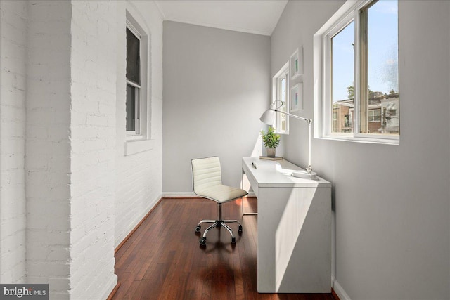 1360 Perry Pl NW, Washington, DC 20010 - laundry area with plenty of natural light, wood finished floors, baseboards, and brick wall