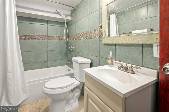 1360 Perry Pl NW, Washington, DC 20010 - bathroom featuring tile walls, shower / tub combo, vanity, and toilet