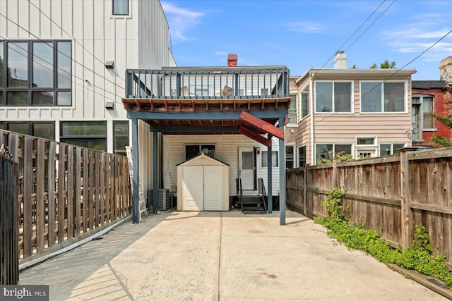1360 Perry Pl NW, Washington, DC 20010 - rear view of property with a wooden deck, a fenced backyard, and central AC unit