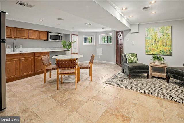 1360 Perry Pl NW, Washington, DC 20010 - dining room featuring crown molding, baseboards, and recessed lighting