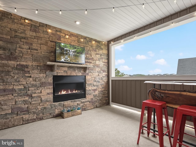 7330 Isabella Rd, Laurel, MD 20723 - bar area with carpet and an outdoor stone fireplace
