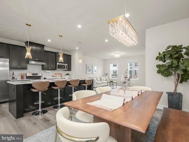 7330 Isabella Rd, Laurel, MD 20723 - dining room featuring light wood-type flooring, a chandelier, and recessed lighting