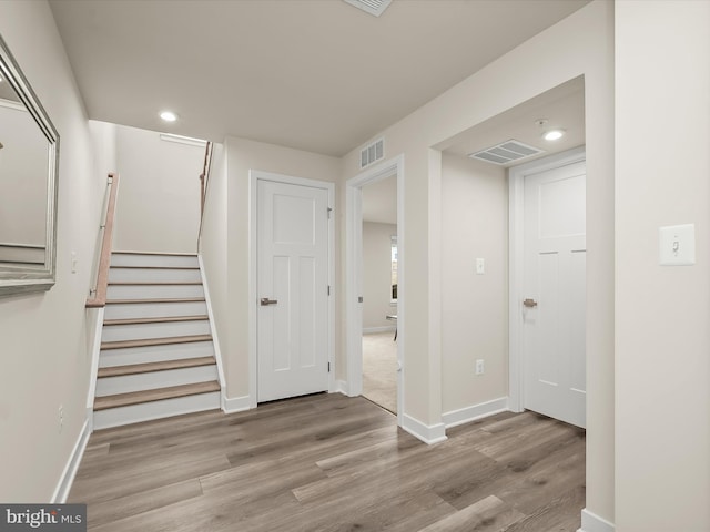 7330 Isabella Rd, Laurel, MD 20723 - hall featuring wood finished floors, stairway, and recessed lighting