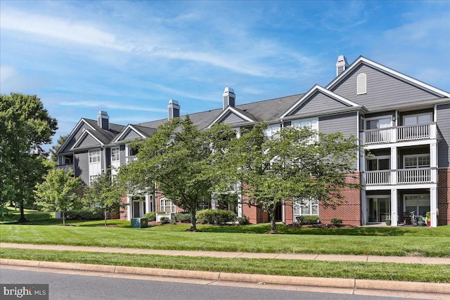 20273 Beechwood Ter Unit 103, Ashburn, VA 20147 - view of front of home with a front yard and brick siding