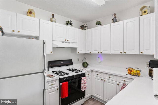 20273 Beechwood Ter Unit 103, Ashburn, VA 20147 - kitchen with white appliances, under cabinet range hood, light countertops, white cabinetry, and a textured ceiling
