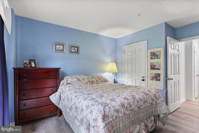 20273 Beechwood Ter Unit 103, Ashburn, VA 20147 - bedroom featuring wood finished floors and baseboards