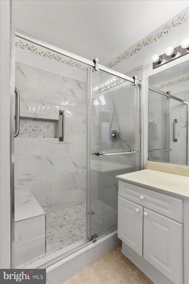20273 Beechwood Ter Unit 103, Ashburn, VA 20147 - full bathroom featuring vanity and a marble finish shower