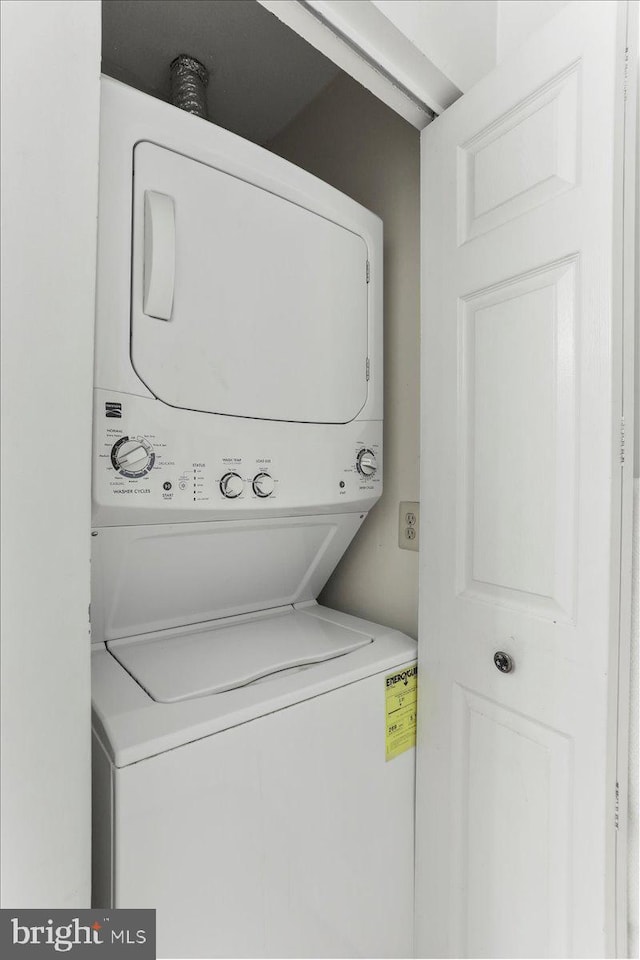 20273 Beechwood Ter Unit 103, Ashburn, VA 20147 - laundry area featuring stacked washer / dryer