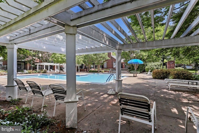 20273 Beechwood Ter Unit 103, Ashburn, VA 20147 - community pool featuring a pergola and a patio