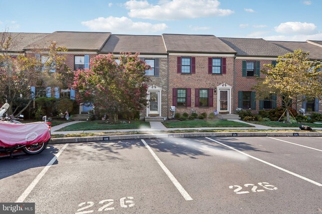 226 Troon Ct, Royersford, PA 19468 - view of front of property with uncovered parking and brick siding