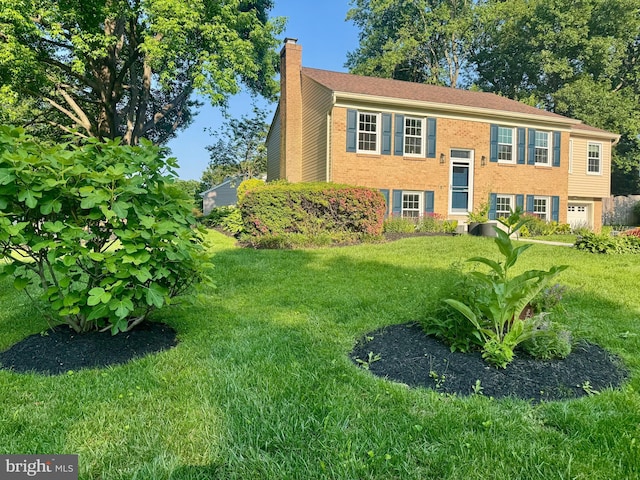 4909 King David Blvd, Annandale, VA 22003 - bi-level home with a chimney, a front yard, and brick siding
