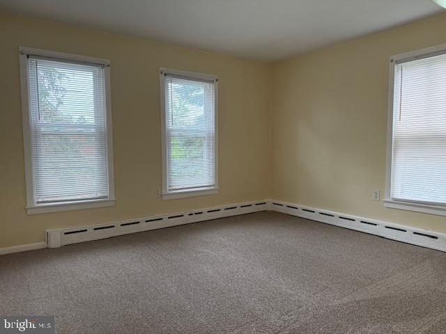 2329 Canby St, Harrisburg, PA 17103 - empty room with carpet, a baseboard radiator, and baseboards
