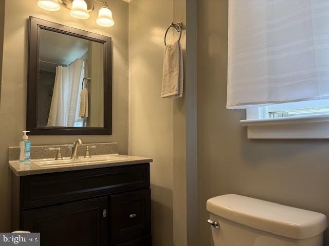 2329 Canby St, Harrisburg, PA 17103 - full bathroom featuring toilet, vanity, and a shower with curtain
