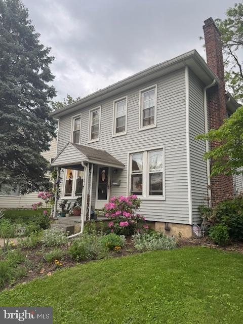 2329 Canby St, Harrisburg, PA 17103 - view of front facade with a chimney and a front lawn