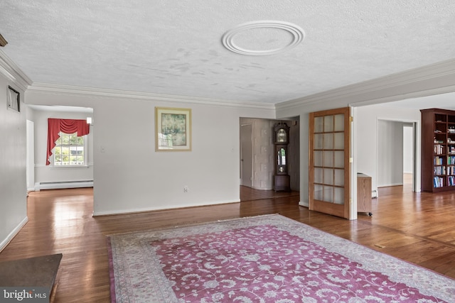 1101 Cherry Ln, Cinnaminson, NJ 08077 - empty room featuring baseboard heating, a textured ceiling, wood finished floors, crown molding, and french doors