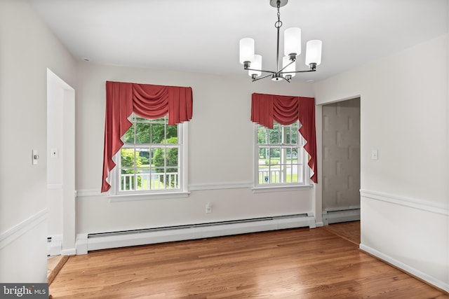 1101 Cherry Ln, Cinnaminson, NJ 08077 - unfurnished dining area with baseboard heating, a chandelier, wood finished floors, and baseboards