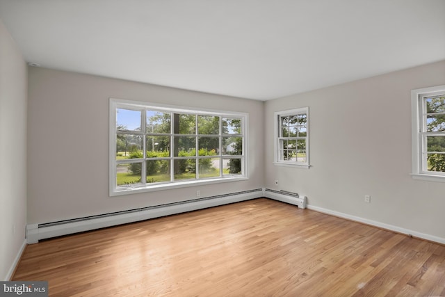 1101 Cherry Ln, Cinnaminson, NJ 08077 - unfurnished room featuring wood finished floors, baseboards, and a baseboard radiator