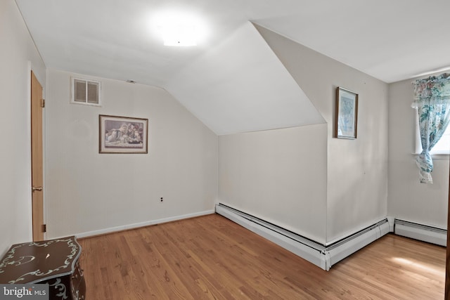 1101 Cherry Ln, Cinnaminson, NJ 08077 - bonus room with baseboard heating, wood finished floors, lofted ceiling, and baseboards