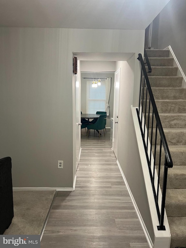 9031 Continental Pl, Landover, MD 20785 - corridor featuring stairway, wood finished floors, and baseboards