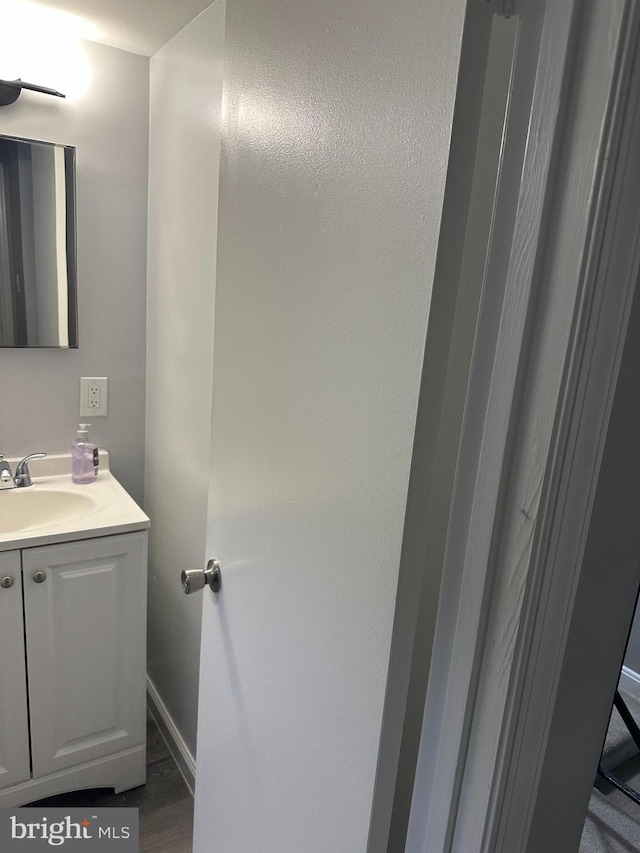 9031 Continental Pl, Landover, MD 20785 - bathroom with vanity, wood finished floors, and baseboards