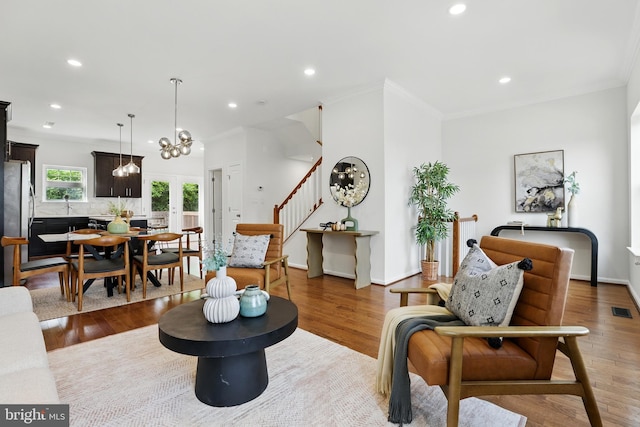 402 Woodcrest Dr SE, Washington, DC 20032 - living area with stairs, recessed lighting, wood finished floors, ornamental molding, and baseboards