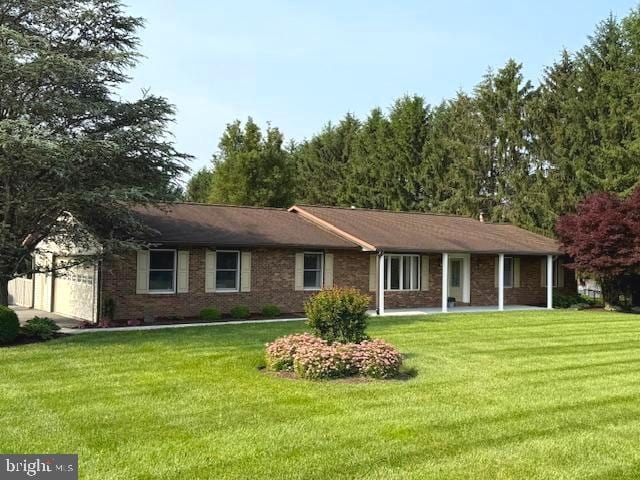245 Streaker Rd, Sykesville, MD 21784 - view of front of house with a front lawn and a garage