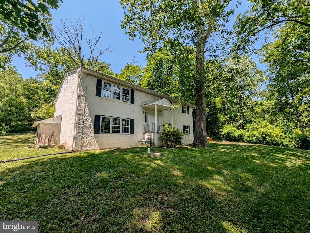6287 Lower Mountain Rd, New Hope, PA 18938 - split level home with stucco siding and a front yard