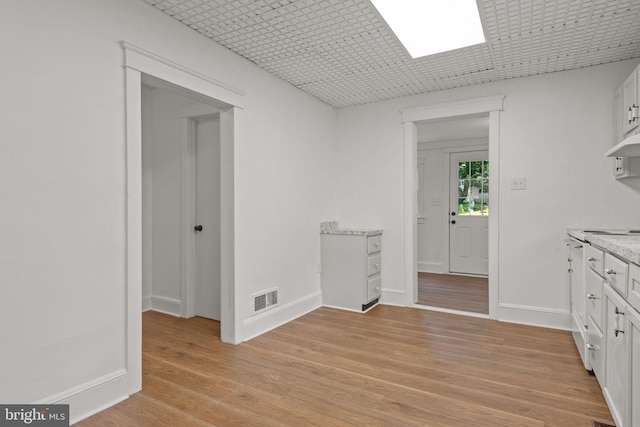 143 N 2nd St, Mount Wolf, PA 17347 - empty room featuring light wood-style flooring and baseboards