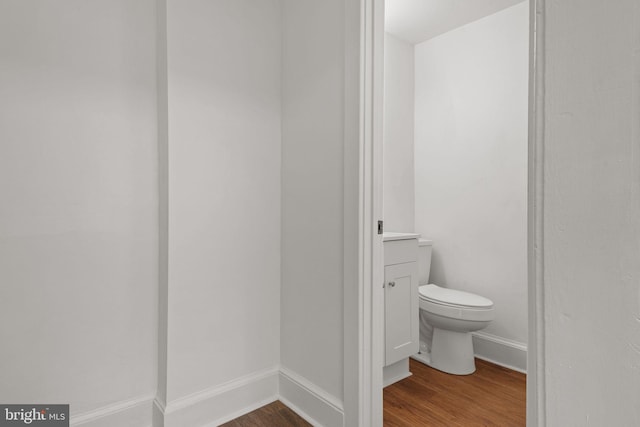 143 N 2nd St, Mount Wolf, PA 17347 - bathroom with wood finished floors, toilet, and baseboards