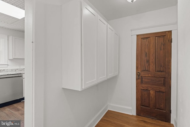 143 N 2nd St, Mount Wolf, PA 17347 - corridor featuring dark wood finished floors and baseboards