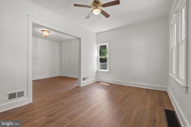 143 N 2nd St, Mount Wolf, PA 17347 - empty room featuring a ceiling fan, dark wood-style floors, and baseboards