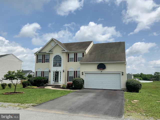 124 Chandlers Glen Dr, Bunker Hill, WV 25413 - colonial home with asphalt driveway, a front yard, a garage, and a shingled roof