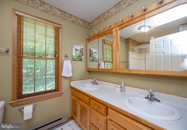 793 Mountainview Dr, Oakland, MD 21550 - bathroom with baseboard heating, double vanity, and a shower with shower door