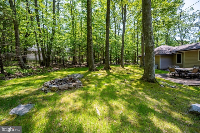793 Mountainview Dr, Oakland, MD 21550 - view of green lawn featuring a fire pit and a patio area