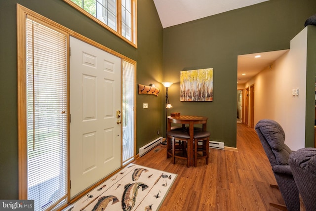 793 Mountainview Dr, Oakland, MD 21550 - entryway with high vaulted ceiling, a baseboard heating unit, and wood finished floors