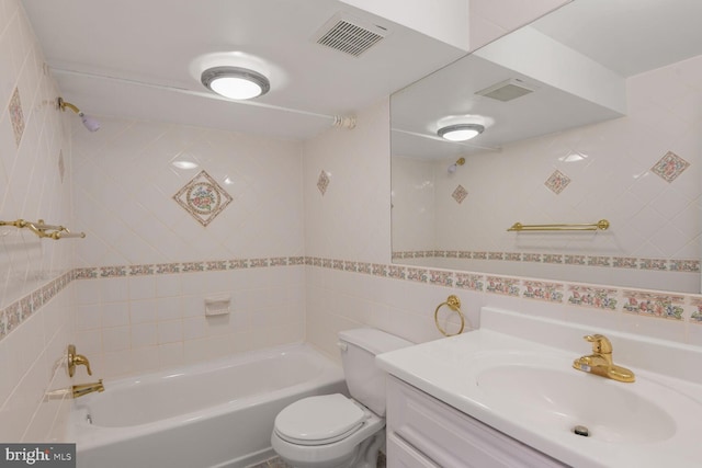 5729 Nevada St, Berwyn Heights, MD 20740 - bathroom with tile walls, toilet, vanity, and washtub / shower combination
